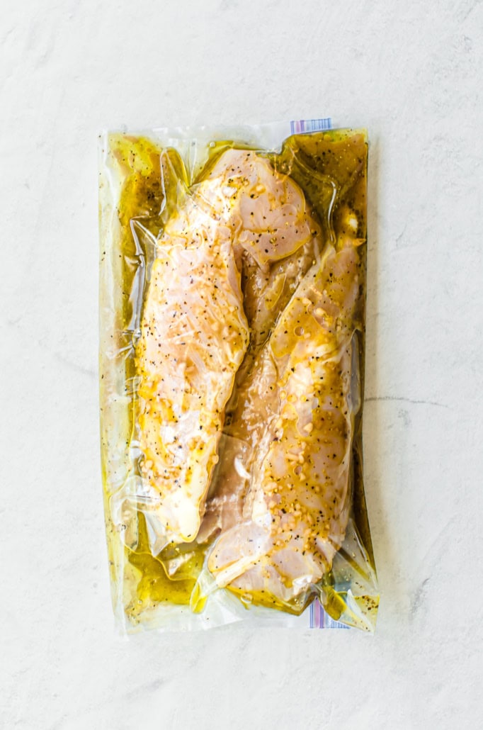 Savory chicken marinade with chicken breasts in a freezer bag.