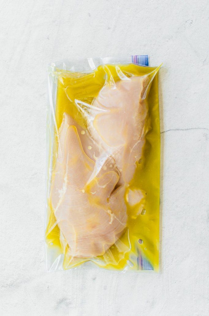 Chicken breasts in honey Dijon marinade in freezer bag.