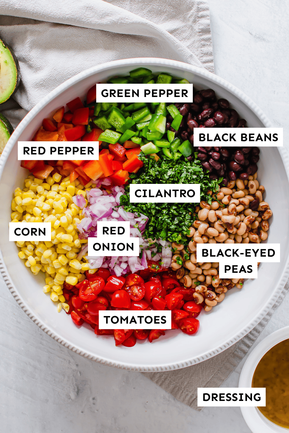 Fiesta chopped salad ingredients labeled in a bowl.