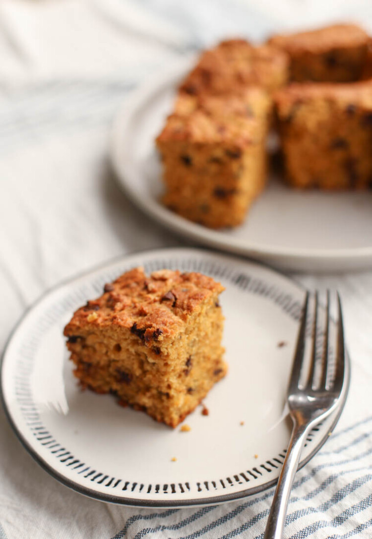 A slice of Thriving Home's make-ahead banana breakfast cake on a small plate with a fork.