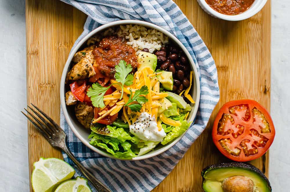 Overhead shot of Chicken burrito bowl with toppings