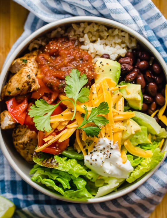 Overhead shot of Chicken burrito bowl with toppings