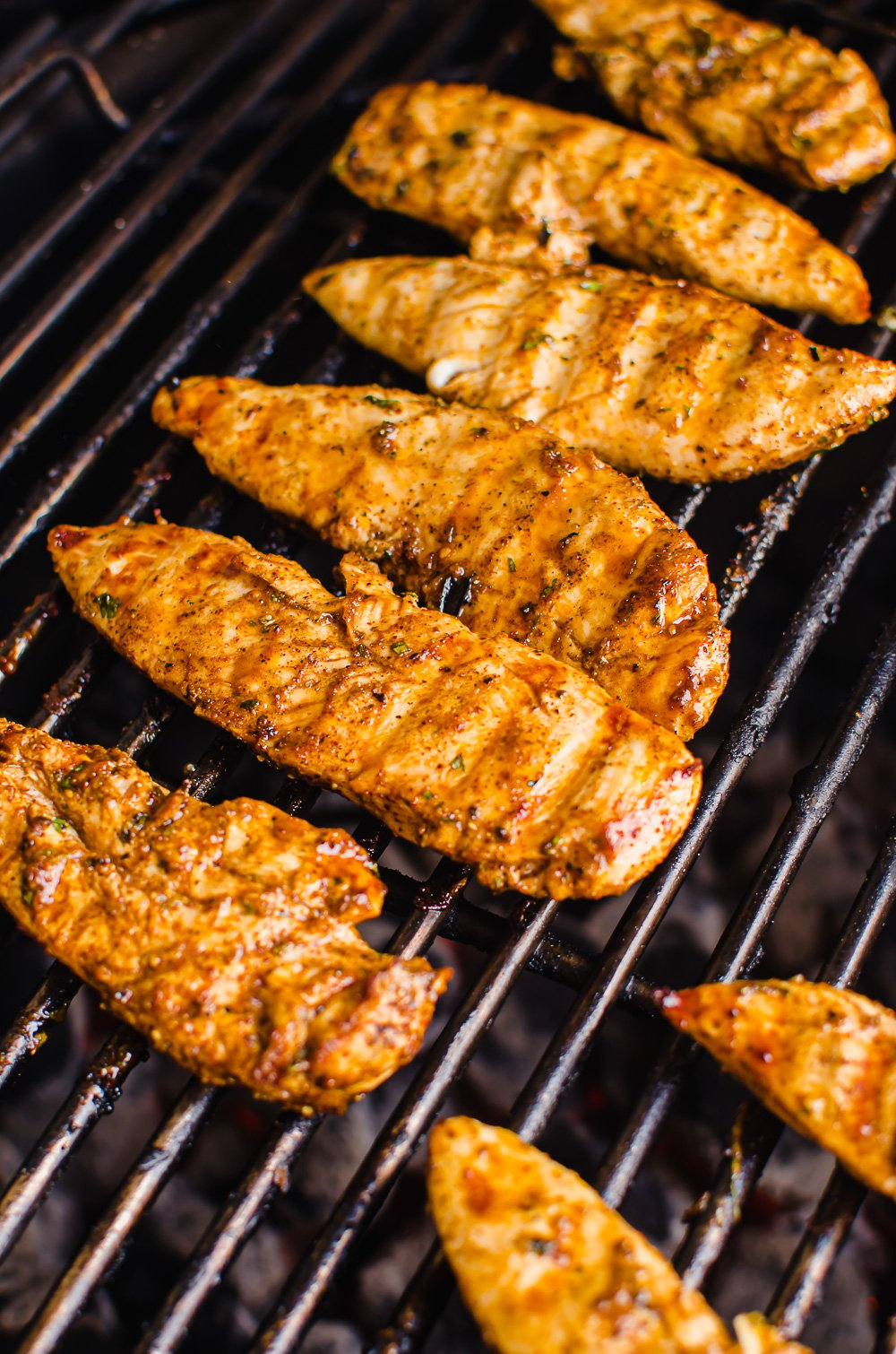 Southwest chicken tenders on a grill.