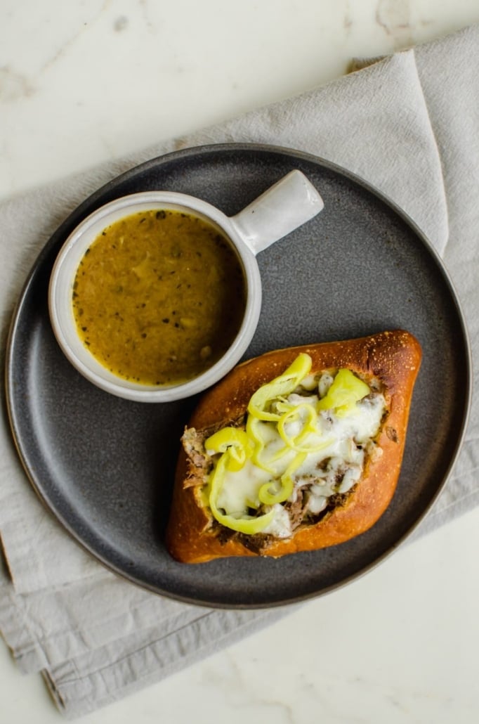 Italian Beef sandwiches on a gray plate - dump and go slow cooker recipe 