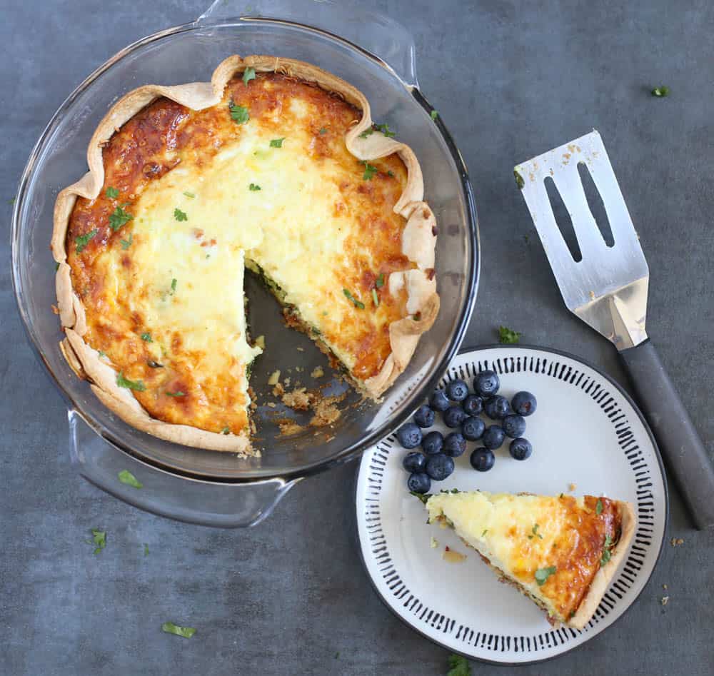 Spinach and bacon quiche in a freezer dish