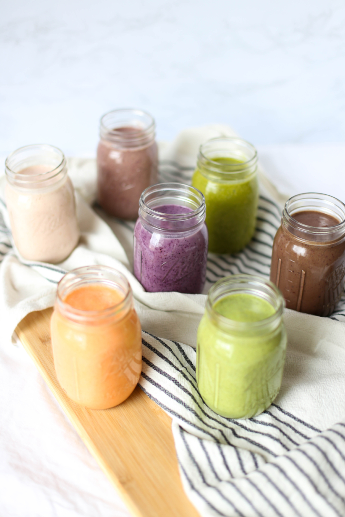 7 colorful smoothies in mason jars