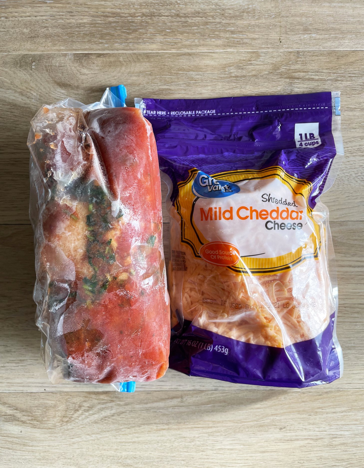 Instant Pot Nachos Freezer Meal with seasonings and meat to be cooked in one freezer bag and cheddar cheese in another.