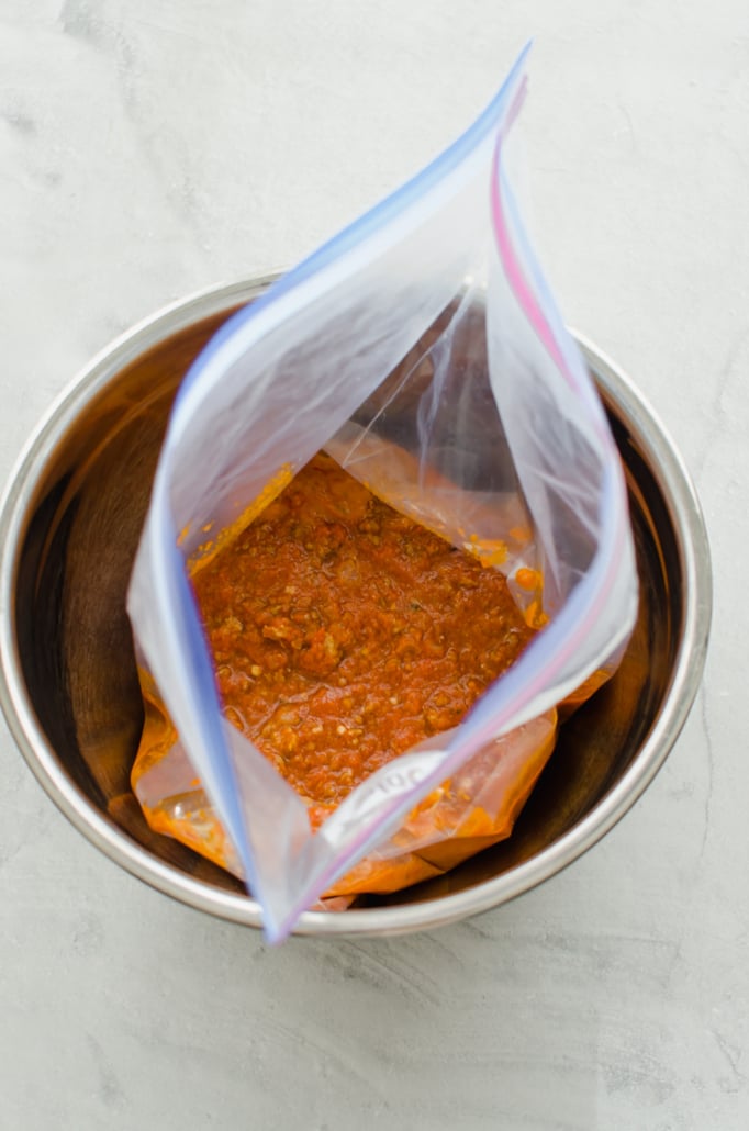 meaty marinara sauce in a freezer bag in the Instant Pot