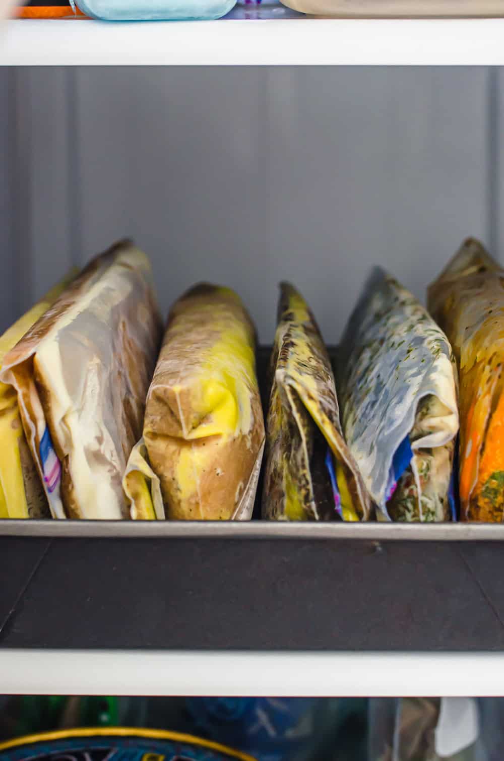 Freezer meals lined up in a pan