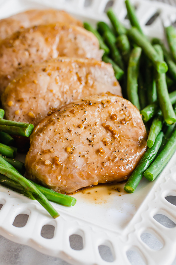 pork chops and green beans on a plate