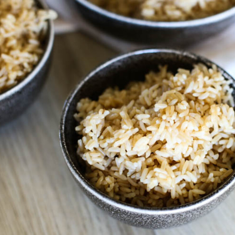 Cooked brown rice in a small bowl.