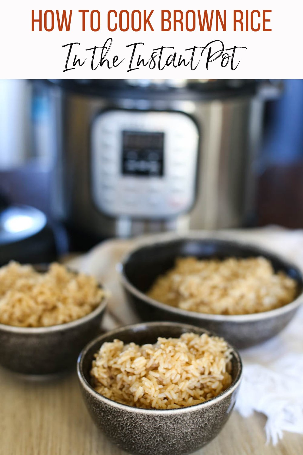 Cooked brown rice in bowls in front of an Instant Pot.