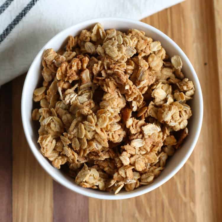 Homemade granola in a white bowl.