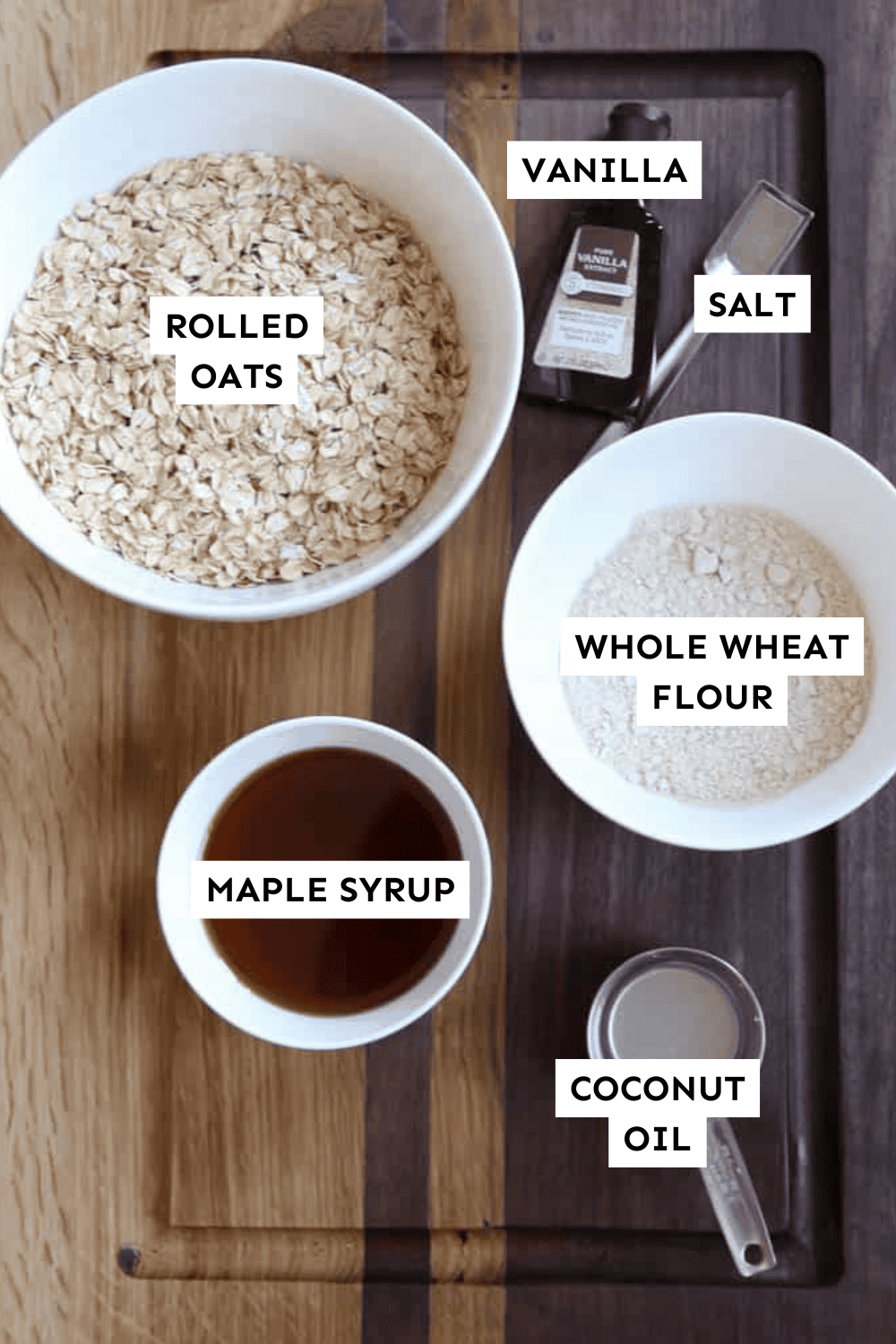 Ingredients for homemade granola measured out and labeled.