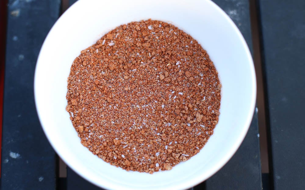 Seasonings for a smoked pork shoulder in a white bowl 