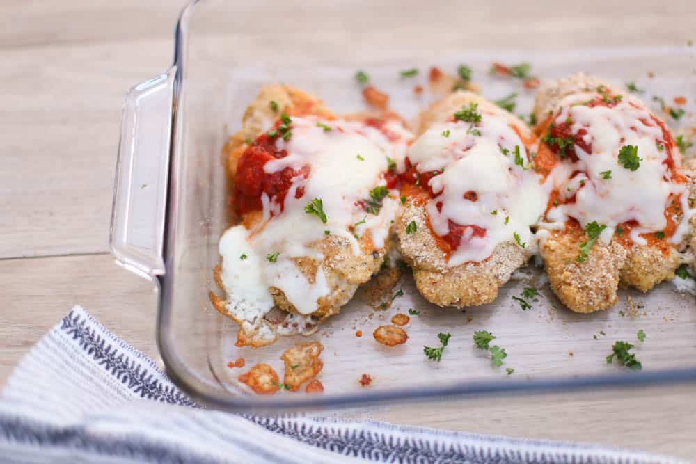 Baked Chicken Parmesan in a glass dish 