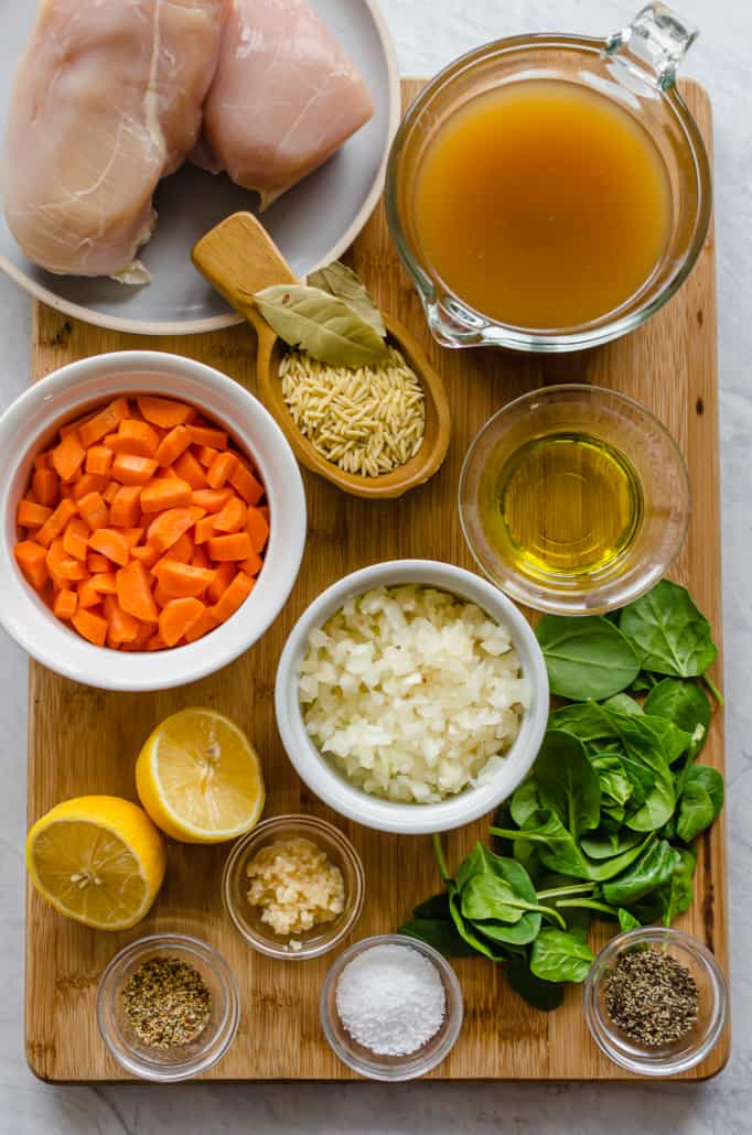 ingredients for Lemon Chicken Orzo Soup on a cutting board