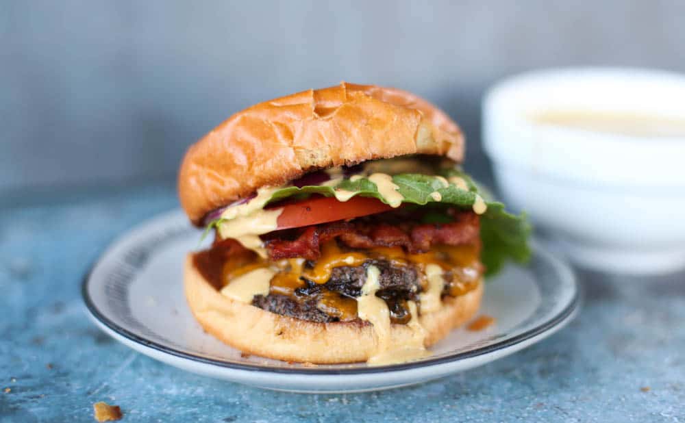 A smash burger with toppings and a secret sauce.