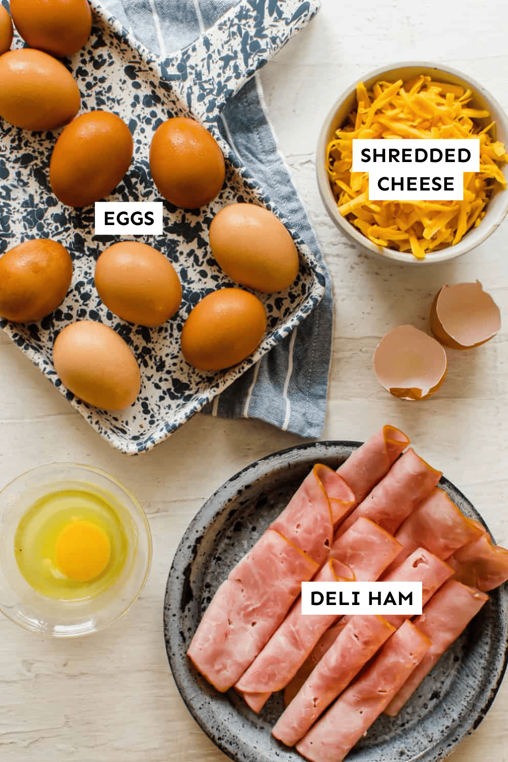 Ingredients for ham and egg cups laid out on a counter and labeled.