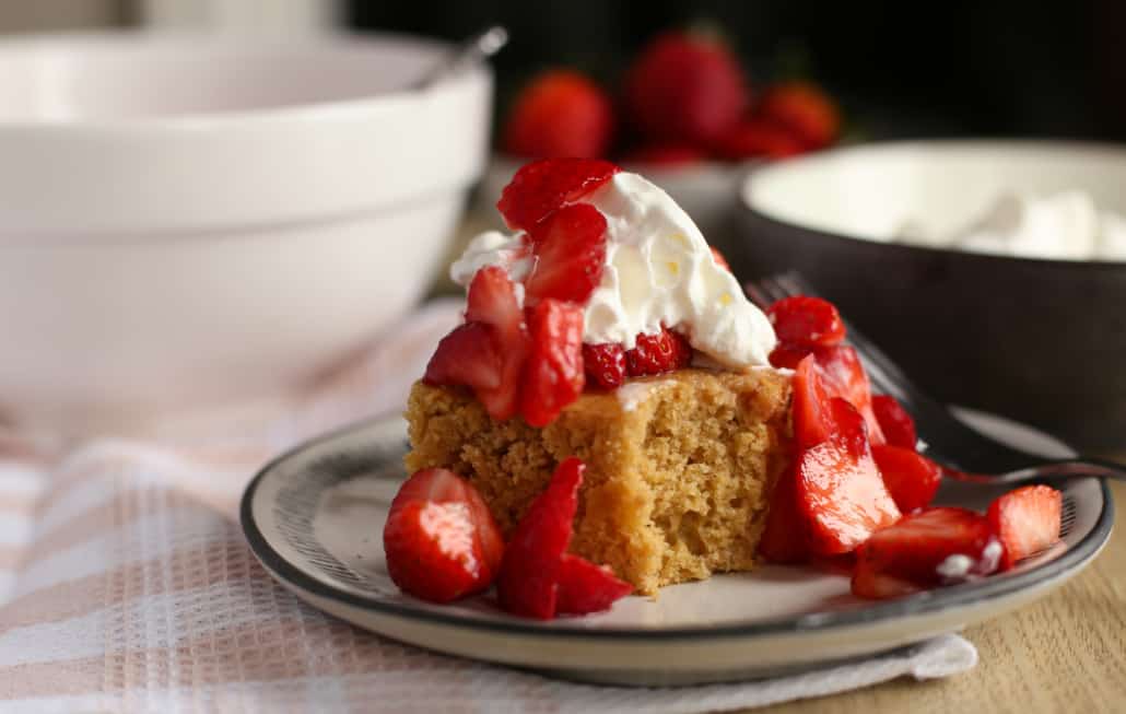 A piece of strawberry shortcake on a plate 