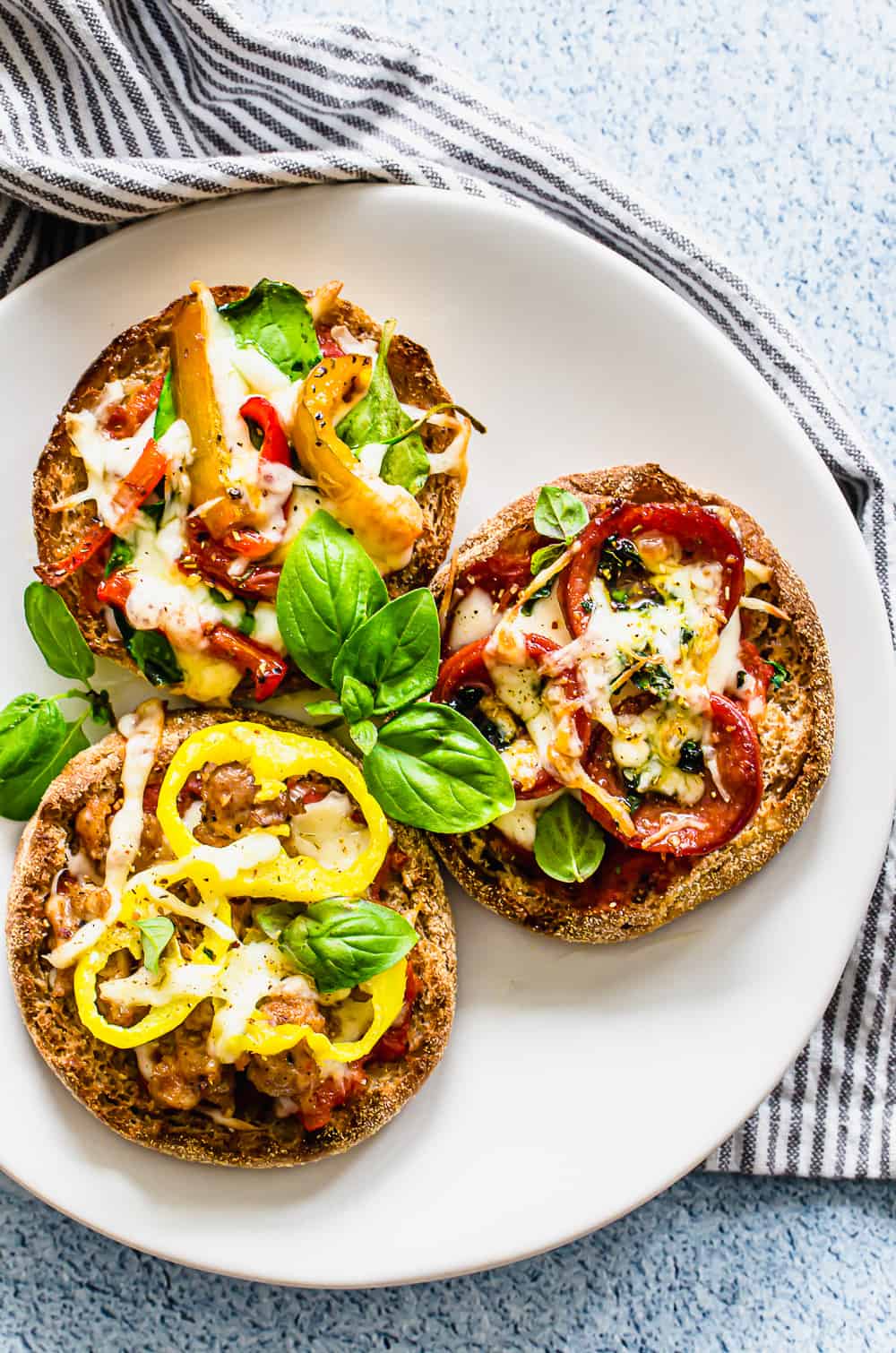 English muffin pizzas on a plate.