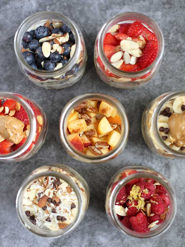 Overhead shot of 7 overnight oats recipes in mason jars.