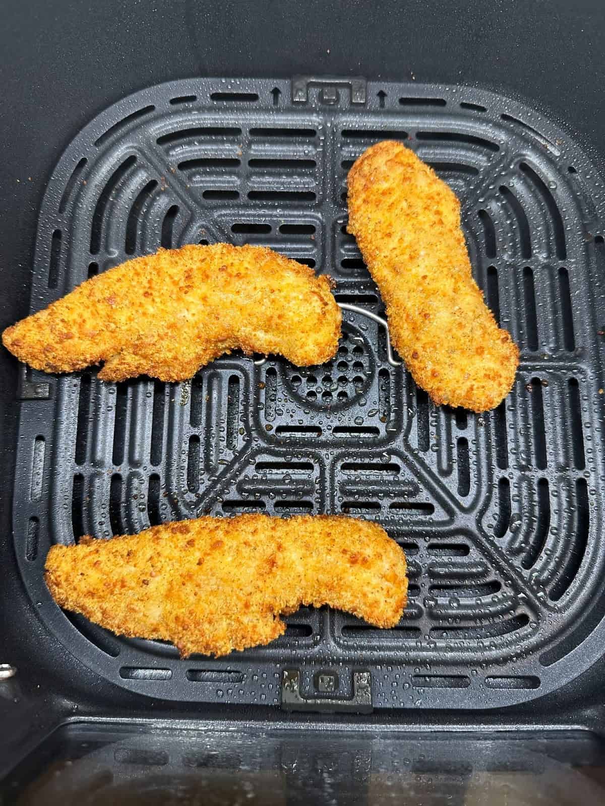 Cooked chicken tenders in the air fryer.
