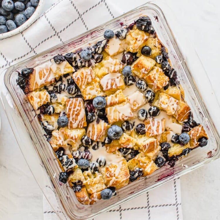 Blueberry French Toast Casserole {with Vanilla Glaze} in a glass casserole dish.