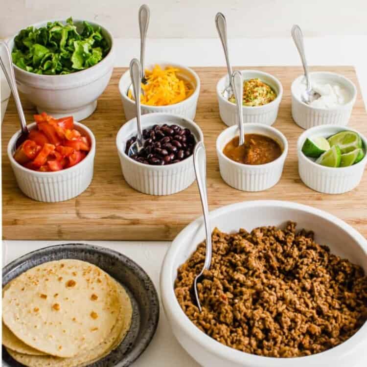Taco bar with all the toppings lined up ready to serve.