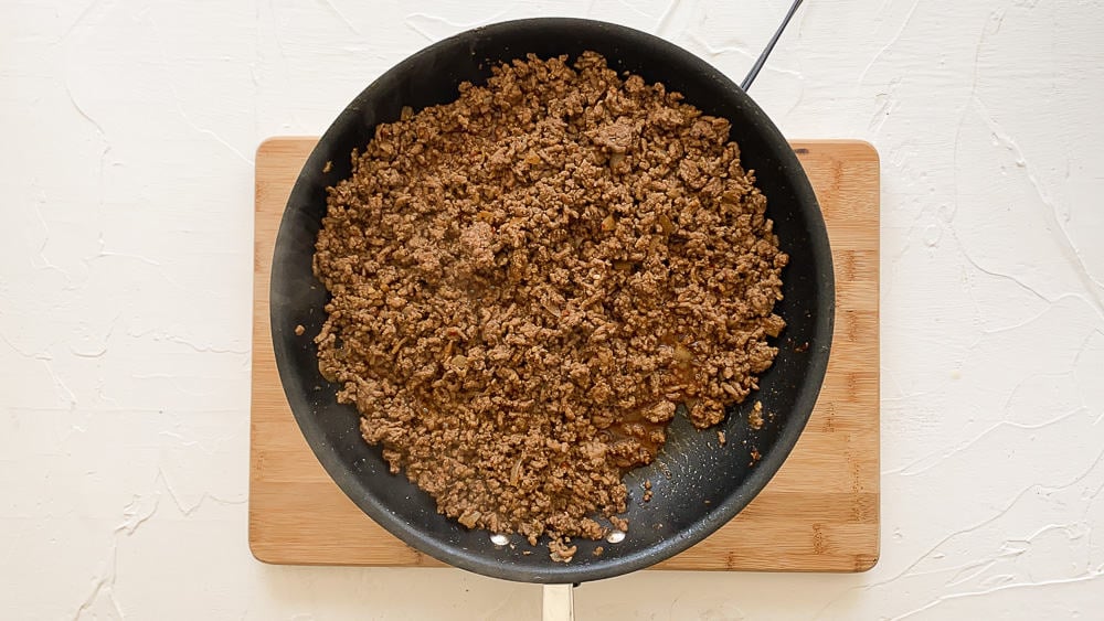 Cooked taco meat in a skillet.