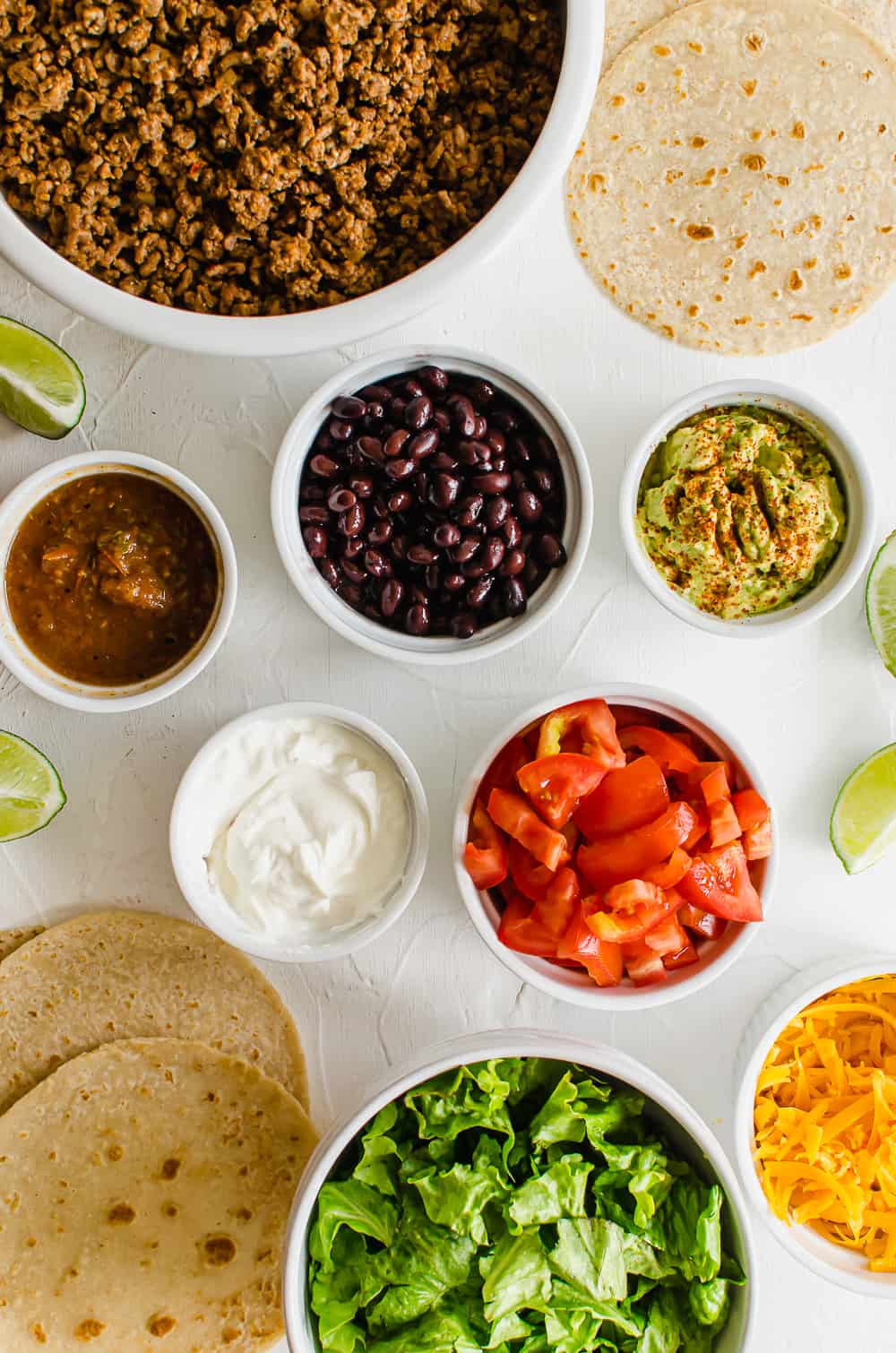 Overhead shot of ingredients for a taco bar.