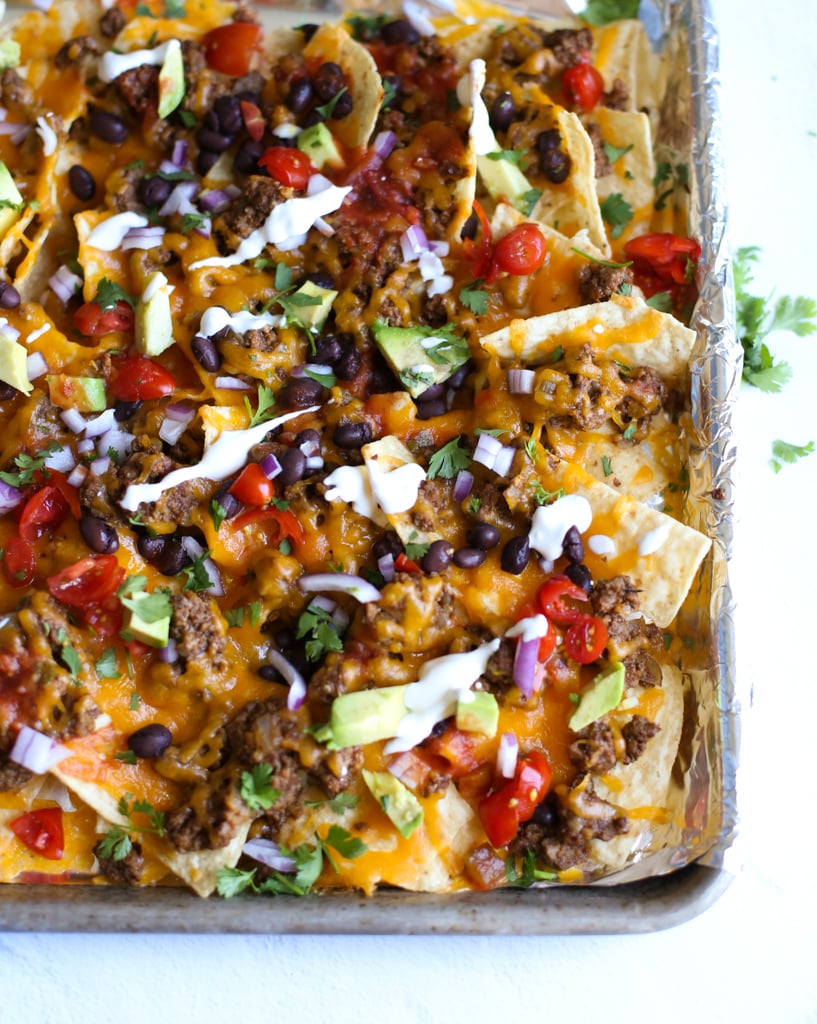 Overhead shot of baked nachos with toppings 