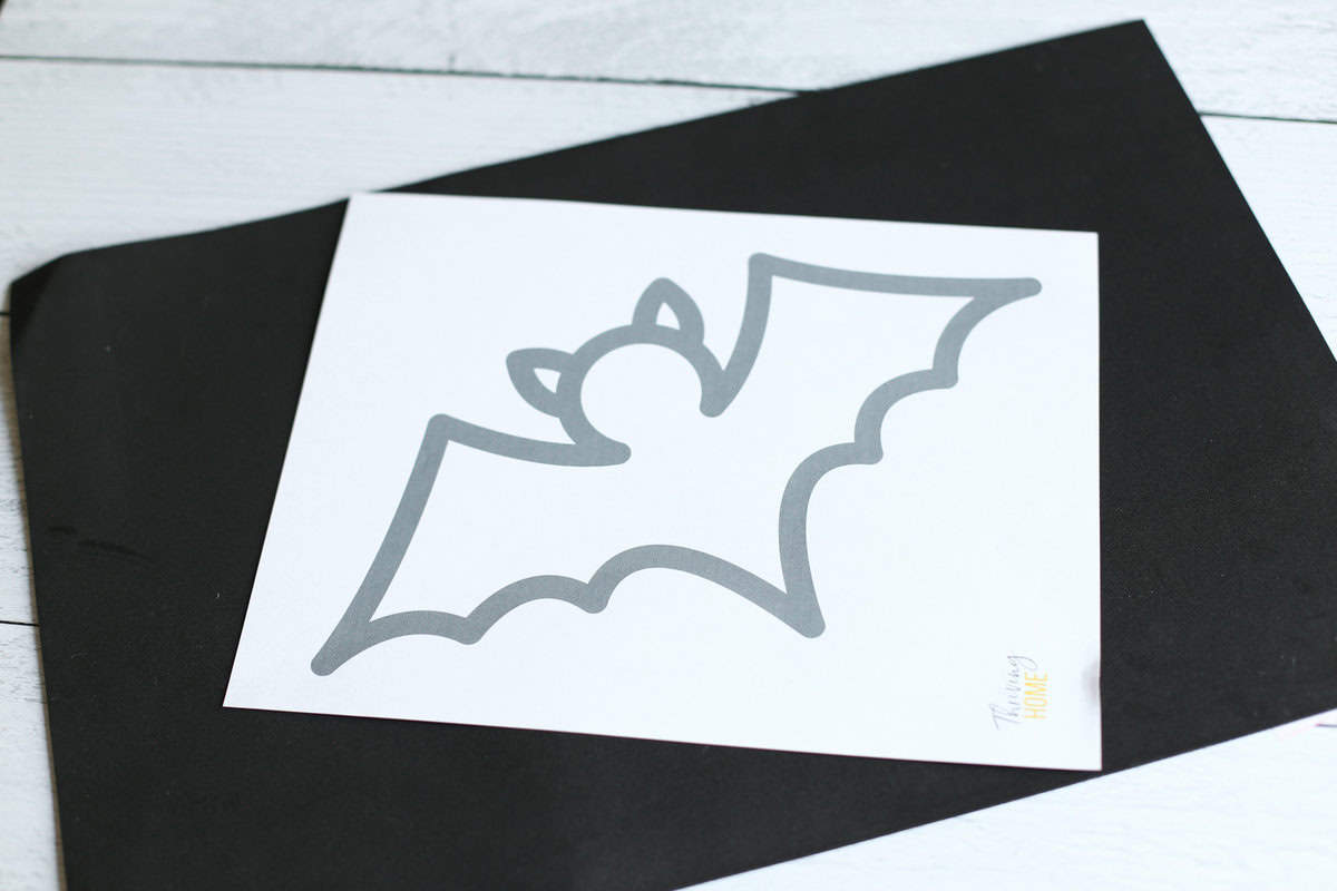 Printed bat template laying on top of a black piece of foam.