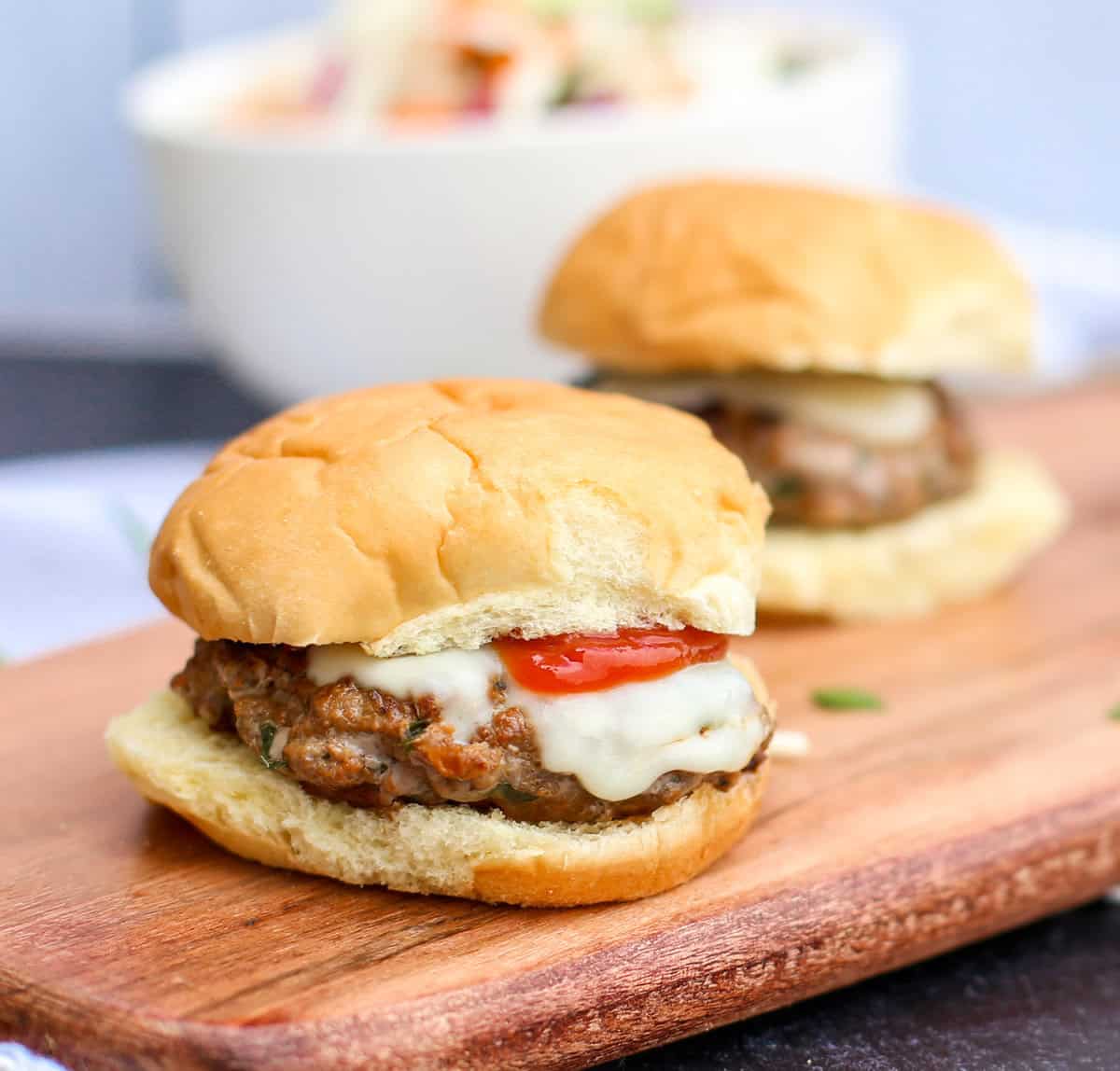 mini italian burgers on a cutting board