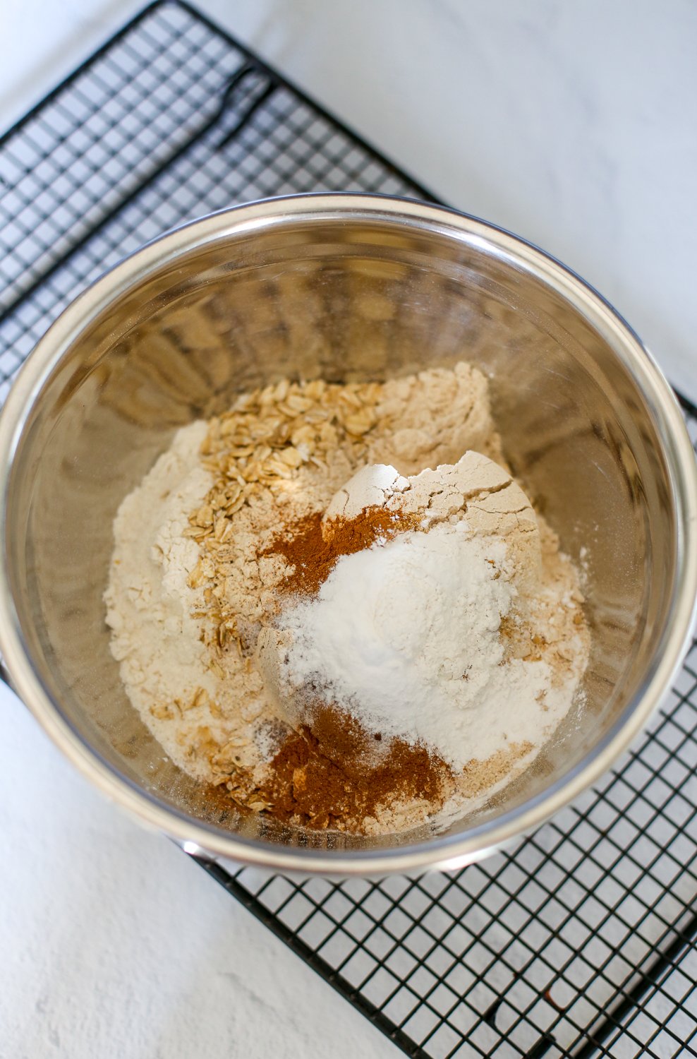 Dry Ingredients for pumpkin spice muffins in a mixing bowl.