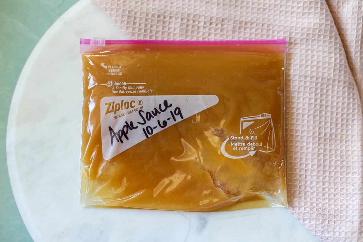 Apple sauce in a freezer bag that is labeled.