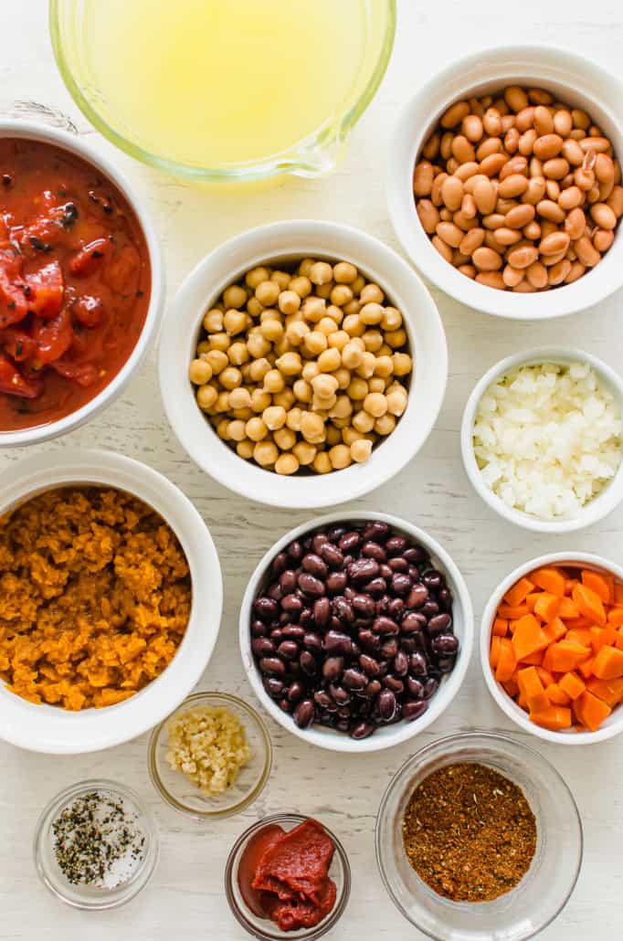 ingredients for vegetarian chili in small bowls on a counter