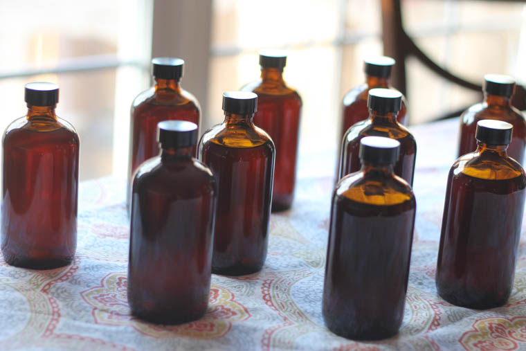 8 ounce amber bottles filled with homemade vanilla extract 