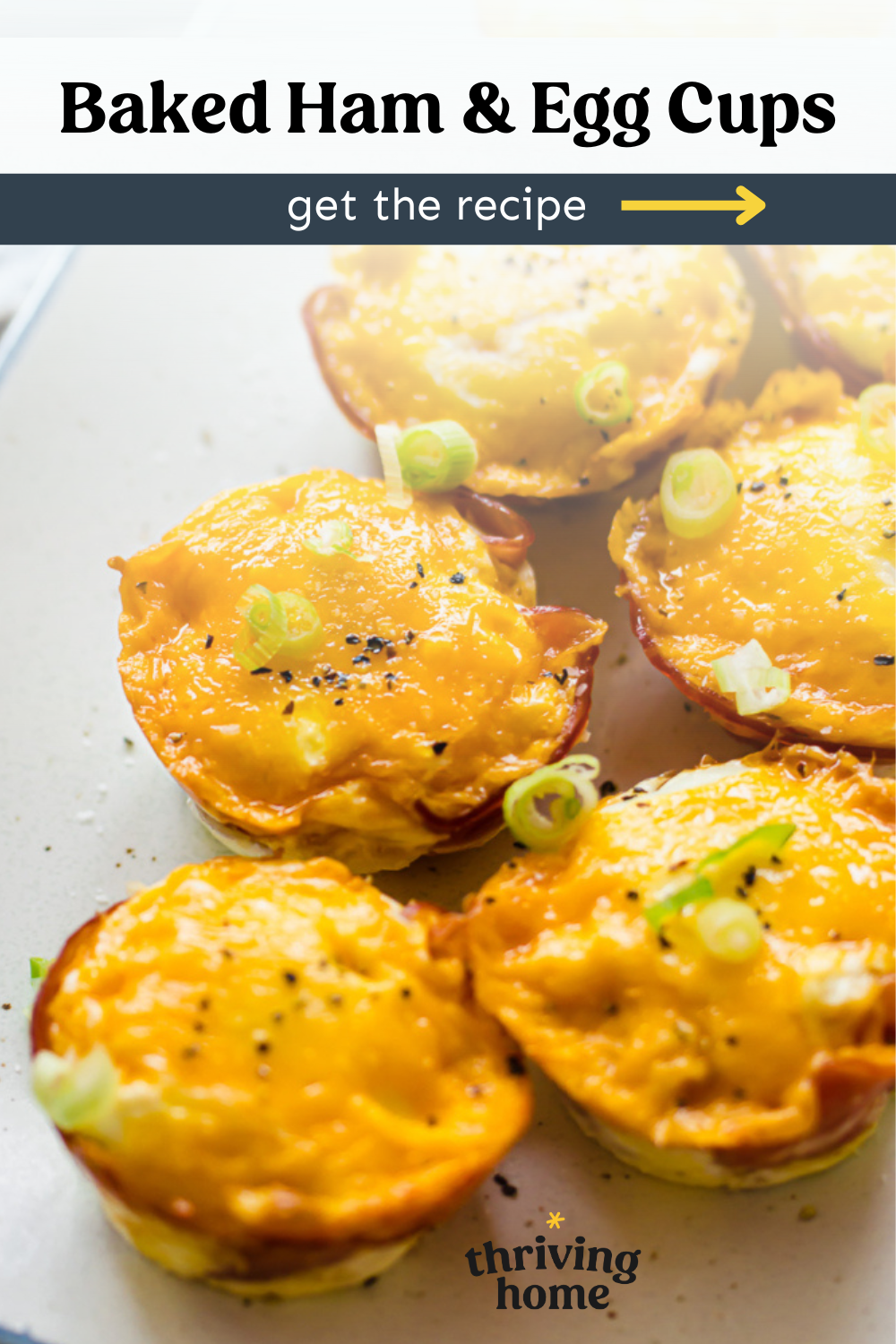 Baked ham and egg cups on a platter.