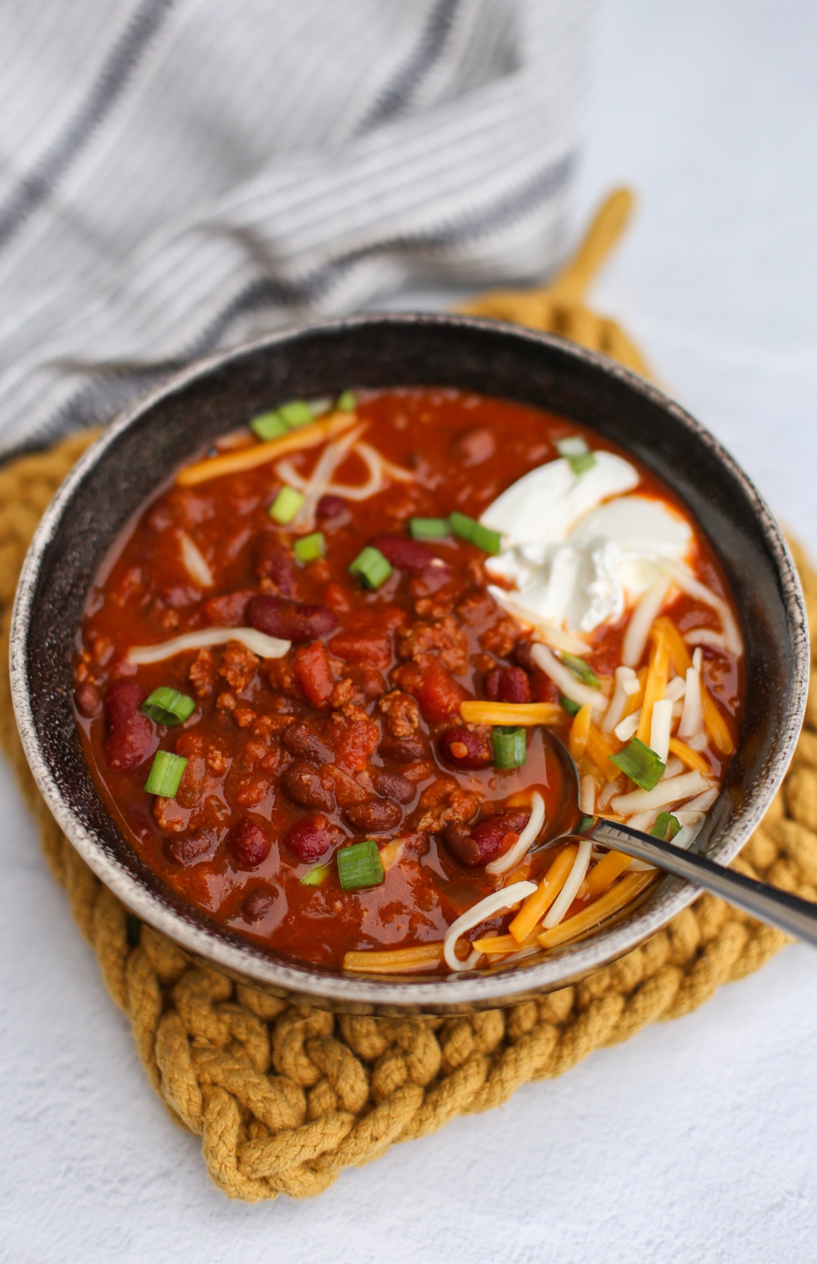 Instant Pot Chili in a bowl with toppings.