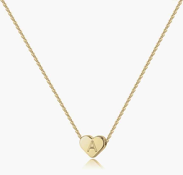 Gold necklace with letter on heart.
