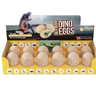 Stock photo of a box of Dig A Dozen Dino Eggs opened so you can see all 12 eggs.
