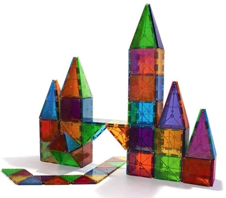 Magna-Tiles put together into a structure like a castle.