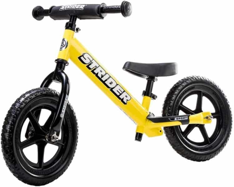Stock photo of a Strider Balance Bike in yellow and black.
