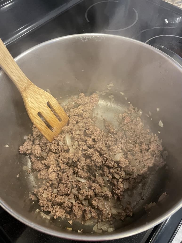 Ground beef for chili being cooked in a pot