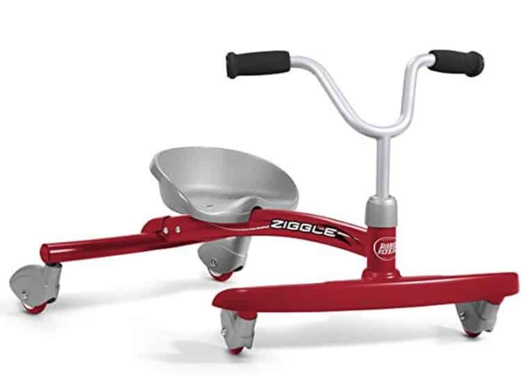 Stock photo of a Ziggle in red and silver - it has 4 caster wheels, a seat, and a handlebar.