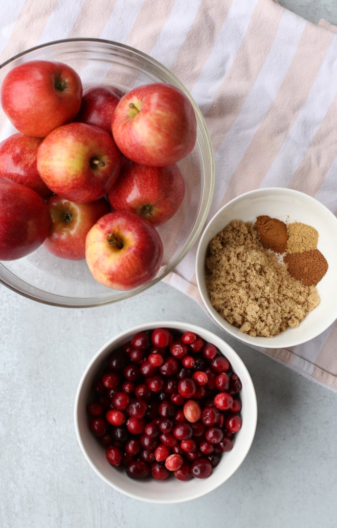 Ingredients for apple cranberry sauce in bowls
