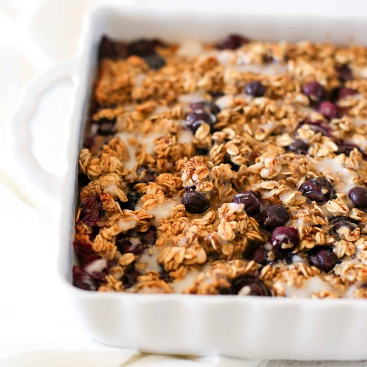 Blueberry baked oatmeal in a white baking dish ready to serve.