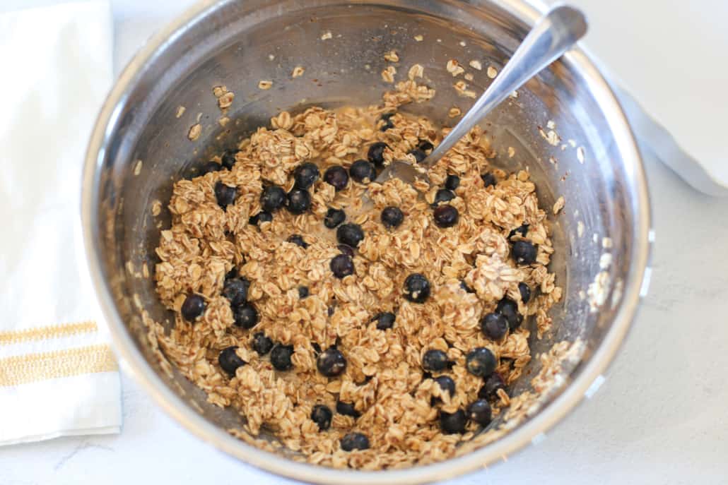Ingredients for blueberry baked oatmeal in a mixing bowl