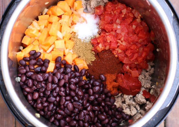 Uncooked Ingredients for Turkey Chili all in the Instant Pot